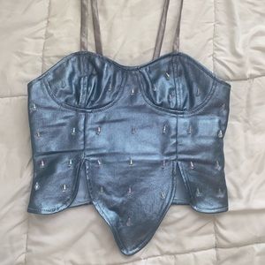 Metallic denim zipper corset top with matching bottoms.